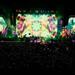 people standing in front of stage partying during nighttime