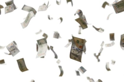 a bunch of money flying through the air