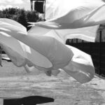 a black and white photo of a white umbrella